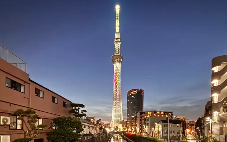Tokyo Skytree towering over the cityscape at twilight