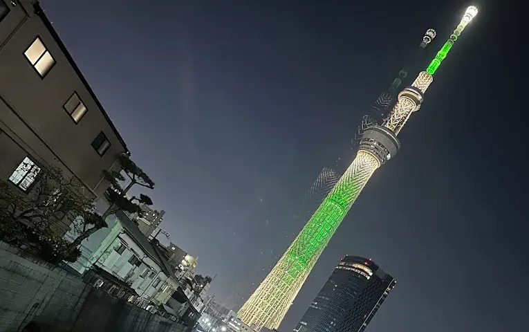 Tokyo Skytree illuminated with green lights