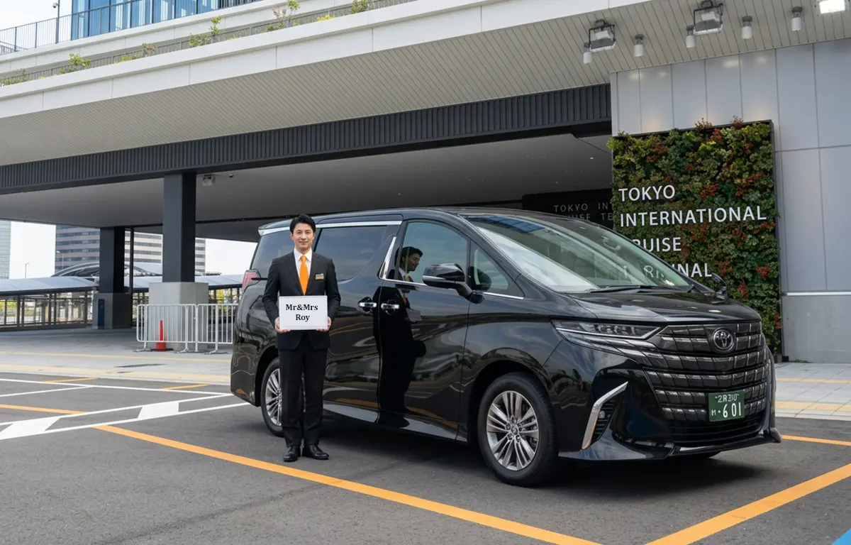 Chauffeur holding a personalized name board at Tokyo International Cruise Terminal